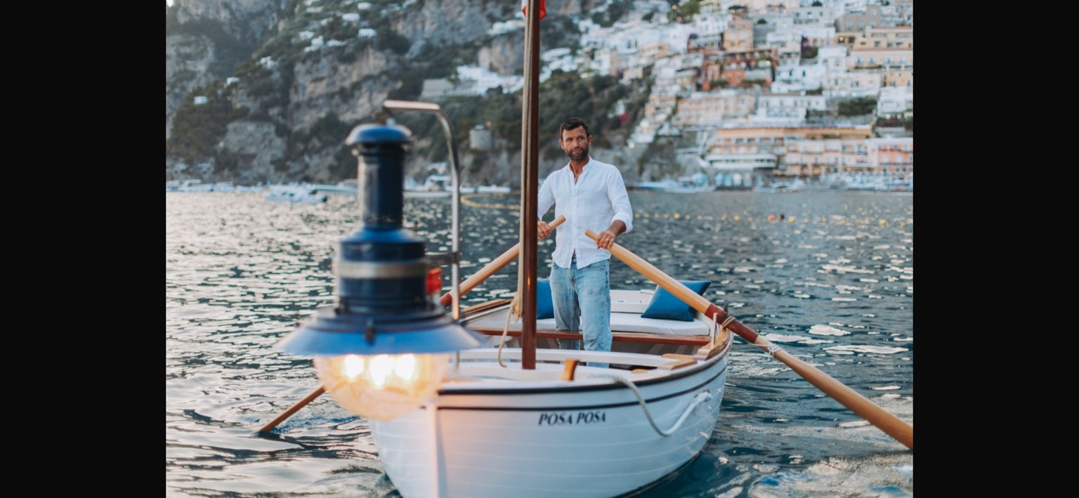 Traditional boatman rowing Posa Posa in Positano